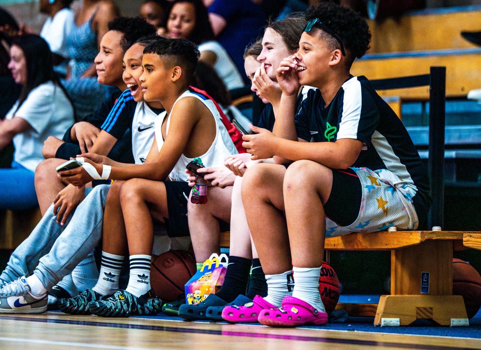 Young basketball players sitting on a bench