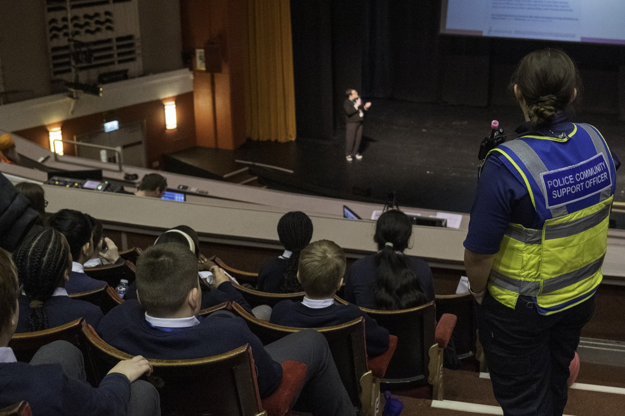 An audience of young people watching a presentation