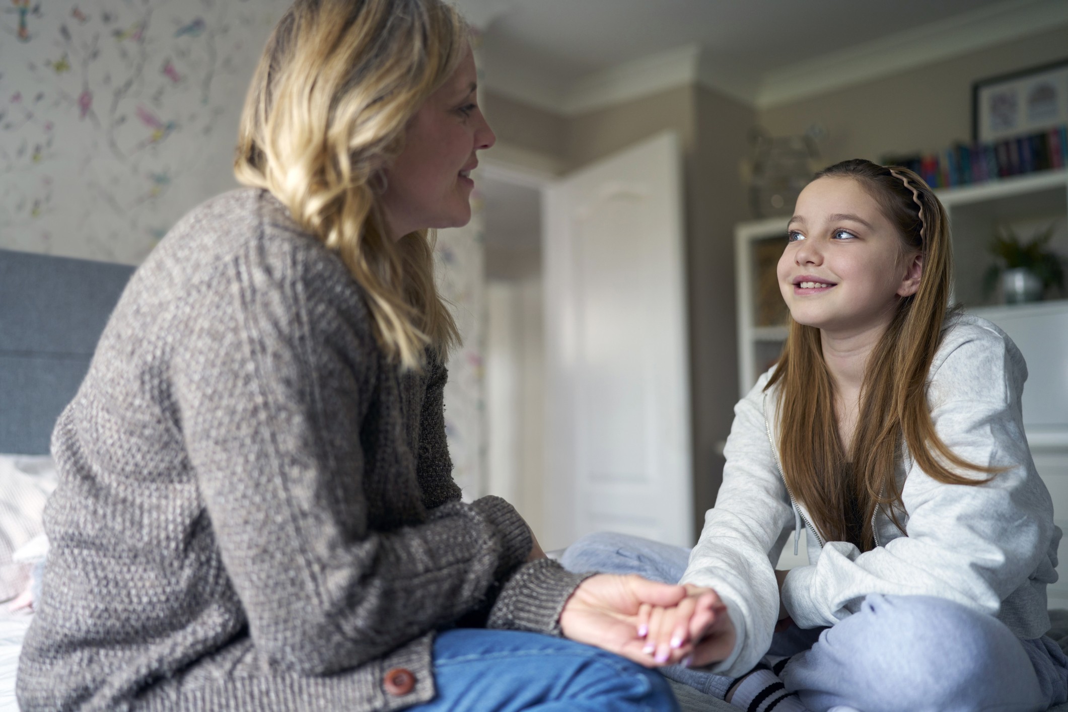 An adult speaking with a young person